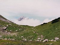The mountain beyond the clouds is on the other side of a valley.  br99 saulajoch 13