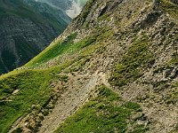 The path crosses a slippery spot (the "hairy spot") before reaching a mountain pasture, or Alp.  br00 sudschafgfl 5x