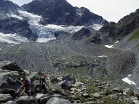 The path leads across these rocks before ascending to towards the glacier and the hut, visible agains the horizon on the right.  sj92 48a043