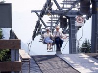 At the top, they slow down or even stop the lift if necesssary.  sj91 45b013