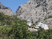 By the time he found the right path, he was too tired (It was very hot.) to make it up there.  gr16 092710590 j