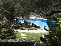 The pool is kidney shaped.  gr16 093010080 j