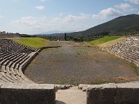 The stadium has horseshoe-shaped "bleachers" around three sides.  gr17 092010472 k