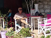 American tourist in cafe. We never missed a chance to drink fresh orange juice in Greece.  gr18 093010421 s