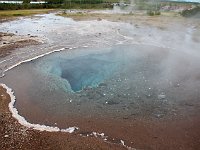 Clear blue -- and scalding -- water of Blesi pool at Geysir