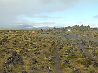 Laufskálavarða (Laufskála Cairn) is a lava mound where a farm was destroyed by the first recorded eruption of Katla in 894. Adding a stone to a cairn the first time one goes by is supposed to bring good luck. Adopting rather than fignting tradition, the Iceland Public Roads Administration now furnishes stones for passersby (probably mostly tourists). Fun custom anyway.
