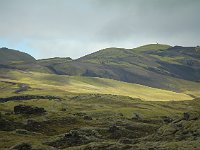Passing clouds gave fascinating lighted spots on the bright green of the land.