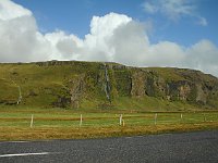 Smaller falls from cliffs along the roadside on the way towards Vík