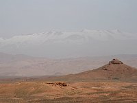 Drive through the Dades Valley  Haut Atlas seen mistily across the desert