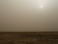 Erg Chigaga  The sand in the air obscured the sun, reduceing it to a bright, silver orb