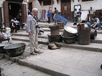 Fez  Tourist looking at dog in the Place Seffarine