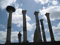 Volubilis  Tourist in the Capitol with stork's nest on left-most column
