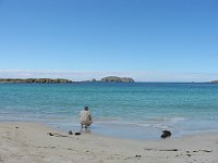 Tourist on beach at Bostadh on Loch Roag  Scottish Highlands, June 2005
