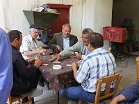 Tire  Turkish gentlemen playing cards in the han. One of them spoke French and was happy to chat with us and explain the han.
