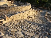 Path leading downhill beside one of the ring-shaped Kouloures, probably storage areas, belonging to the old palace.  gr16 092817333 j