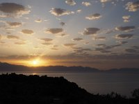 One more sunrise, with small clouds seeming to float above the bay.  gr17 091906310 k