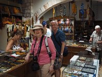 Happy tourists inside the komboloi shop. The famly who runs it were very pleasant and friendly. The oldman at the back makes the komboloi.  gr17 091211100 k