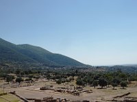 Ancient Messene sneaks up on you, or. rather, you sneak up on it. There are three different views as you walk into it.The first is just a hill and a wall, the back wall of the theater. The second, the first real view of the site is from the top of that  hill. You can barely make out the Ascleipiion from here.  gr18 092412212 s-a