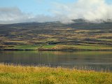 Looking across the fjord at hills on the other side