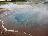 Clear blue -- and scalding -- water of Blesi pool at Geysir