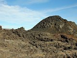 Dried lava is mostly black or dark grey (basalt?), but interspersed with rhyolite and other mineral color.