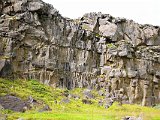 Rock wall near the waterfall. The roughly horizontal joints show well how numerous layers of lava were piled one on top of another.