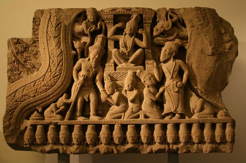 mg07_100114550_j.jpg - Fronton, scene from Kumarasambhava, showing Parvati remaining deaf to words of Shiva disguised as a Brahmin in order to test his spouse; Cambodia, end 12th or beginning 13th century, sandstone