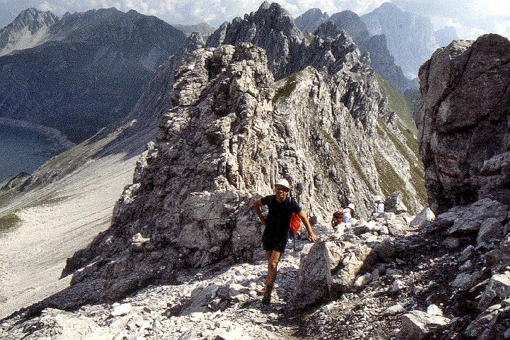 br91_gemsluke__07z_f.jpg - John at the very Lücke (Loch, hole) the first time we made this fascinating walk, in 1991. The steep scree hillside going down towards the lake can be seen on the left.