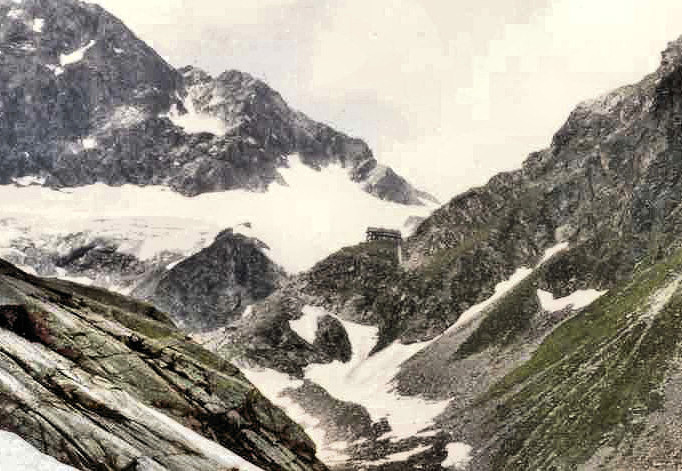 br81_saarbrksite_cr_a.jpg - A close-up just to show where the hut is on top of the cliff that's part of the mountainside on the right. It was at the foot of this cliff that I found the glacier anemone (next picture).