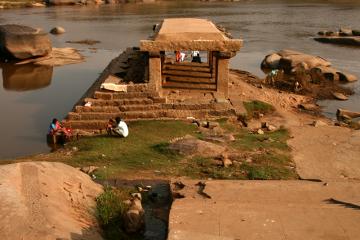Ruined temple with Nandi on the river
