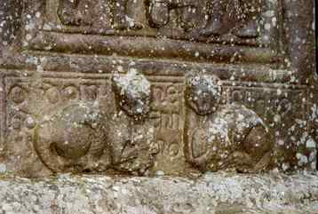 Base of the cross, showing two cats